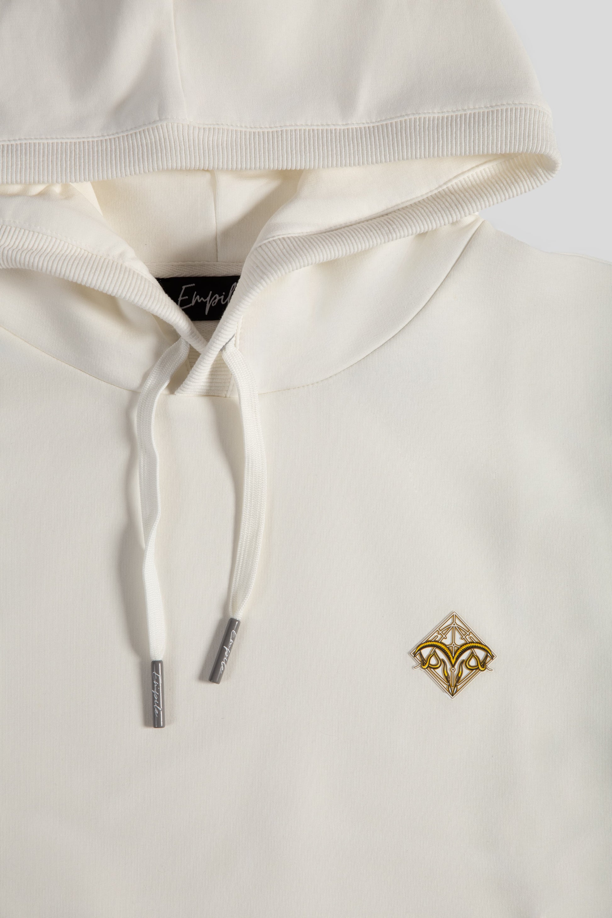 Front details close up of the Empile white longline hoodie